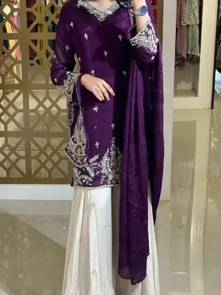 A Showcase of Pakistani Dress Styles in Four Captivating Colors Worn by a Graceful Woman