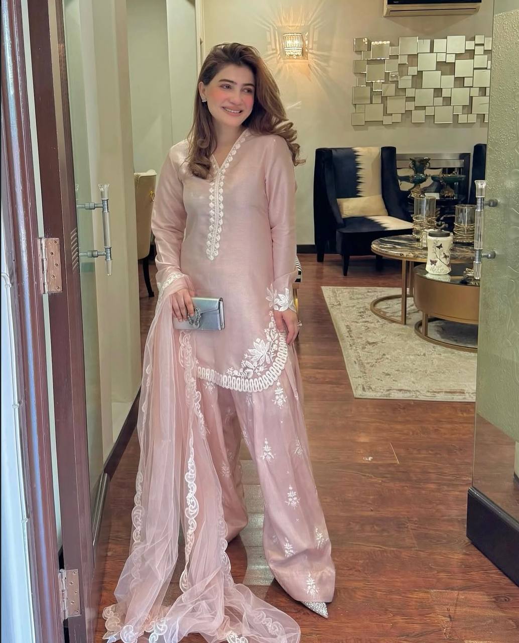 A Vision of Confidence in a Stylish Pink Suit