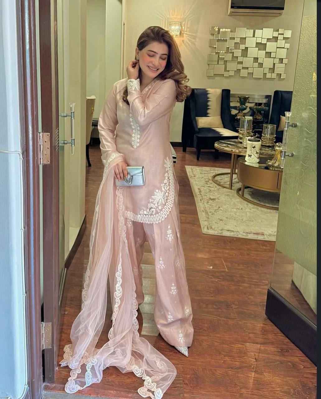 A Vision of Confidence in a Stylish Pink Suit