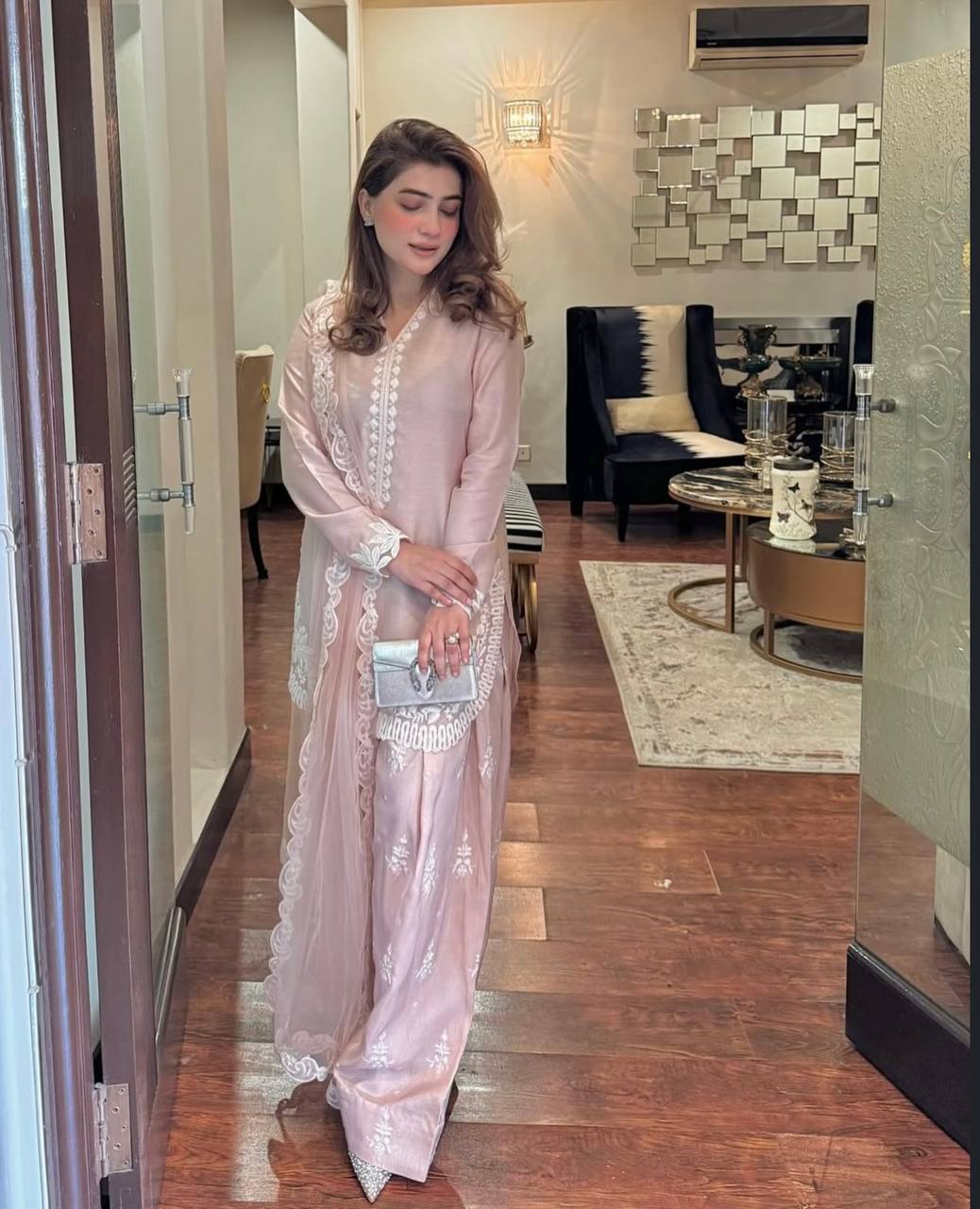 A Vision of Confidence in a Stylish Pink Suit