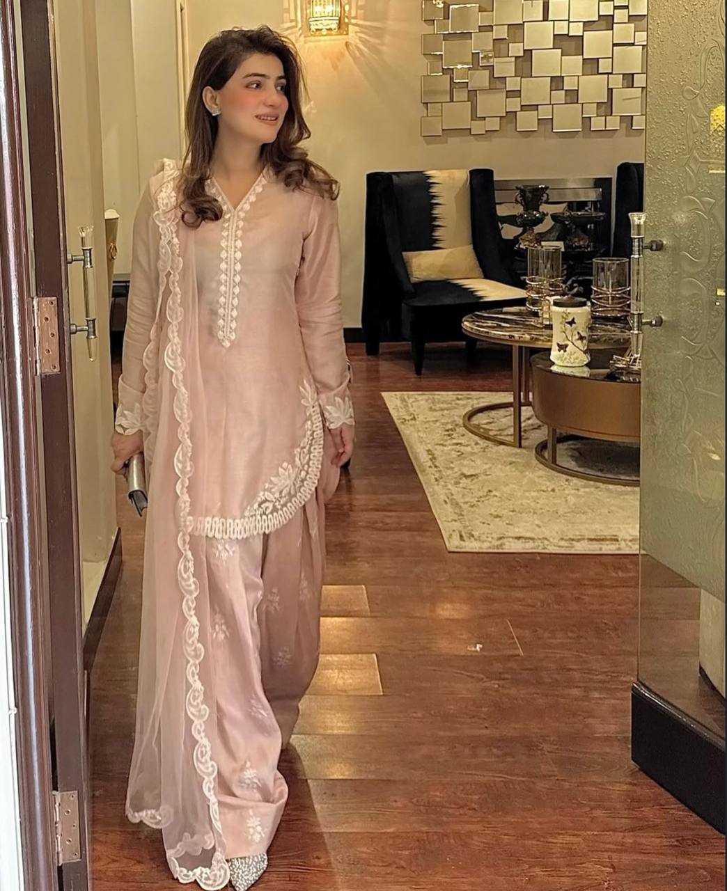 A Vision of Confidence in a Stylish Pink Suit