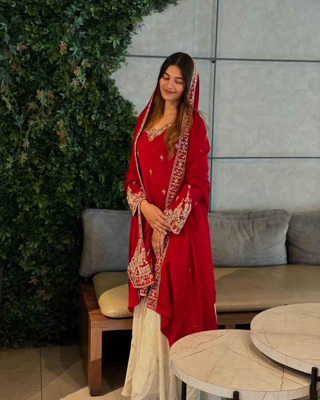 A Showcase of Pakistani Dress Styles in Four Captivating Colors Worn by a Graceful Woman