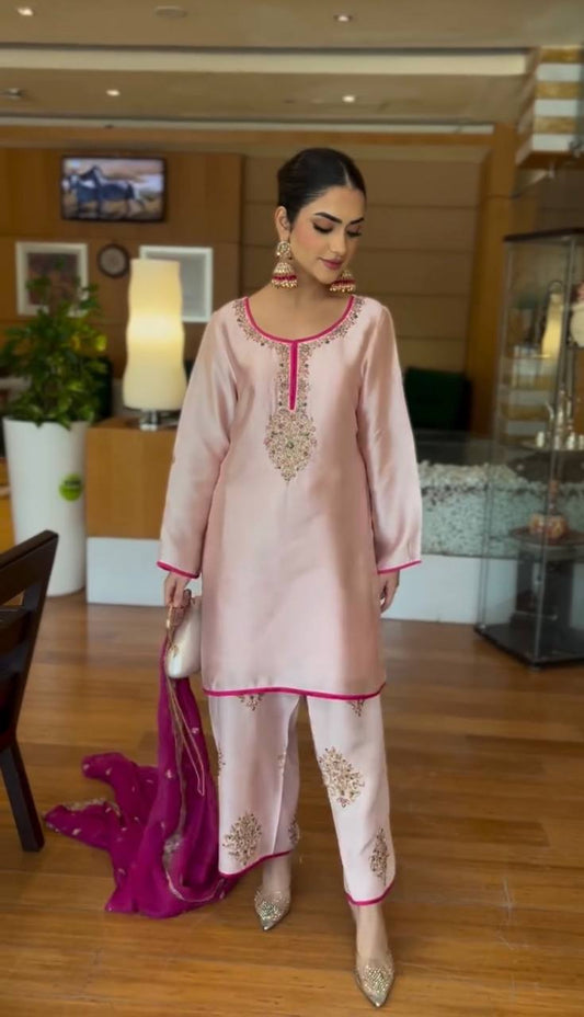 A Graceful Woman in a Pink Salwar Suit Captivating the Hotel Lobby Atmosphere