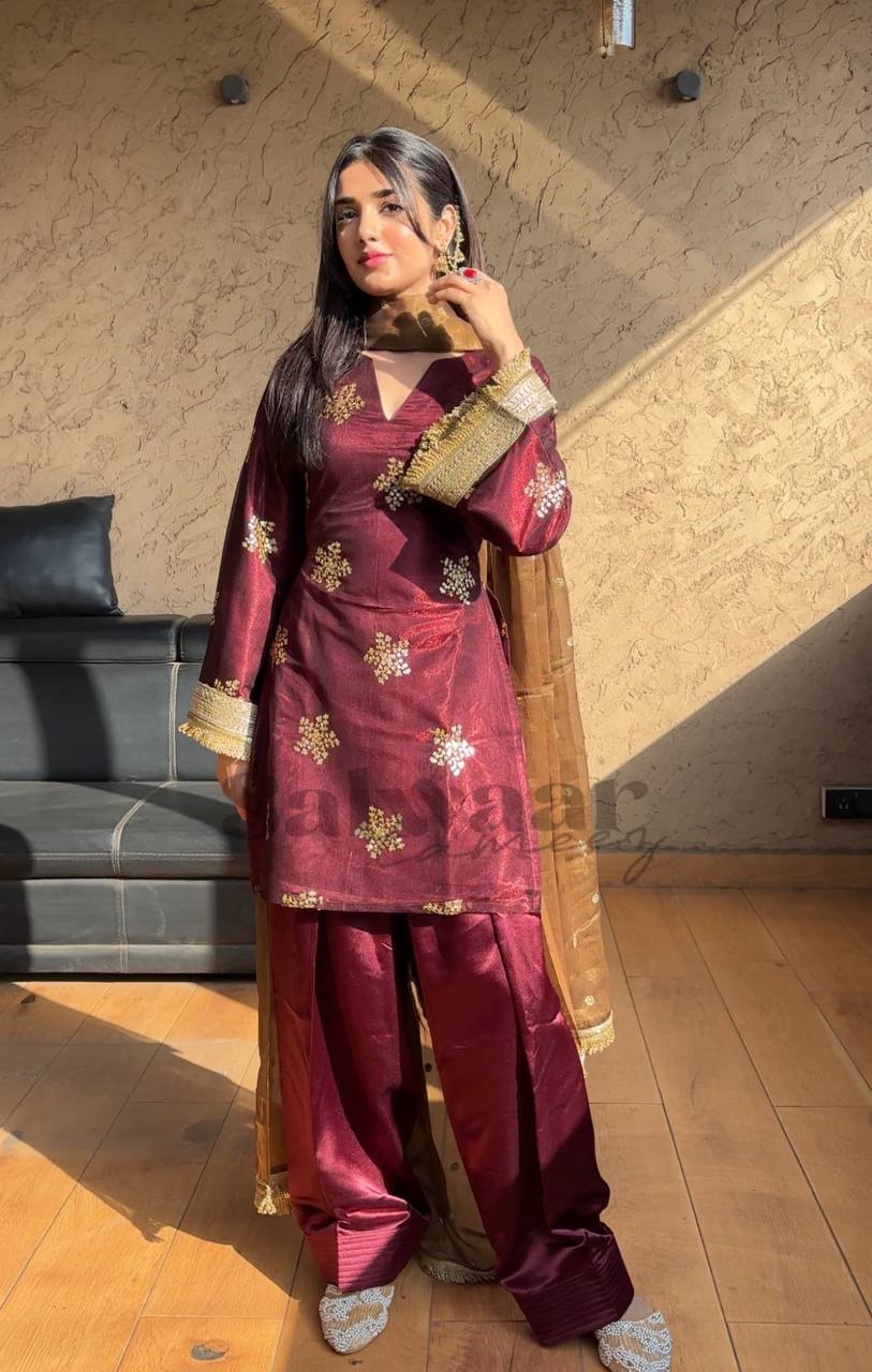 A Portrait of Grace in a Luxurious Maroon Ensemble