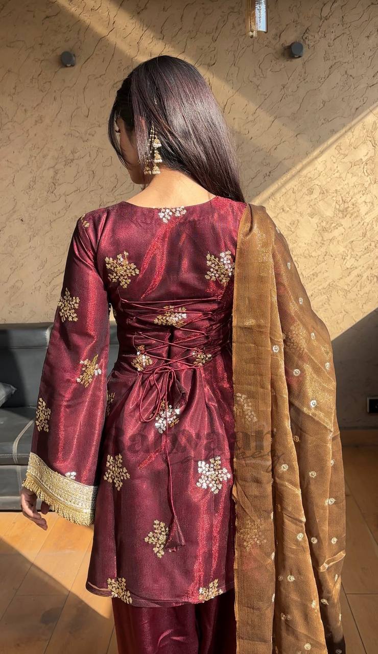 A Portrait of Grace in a Luxurious Maroon Ensemble