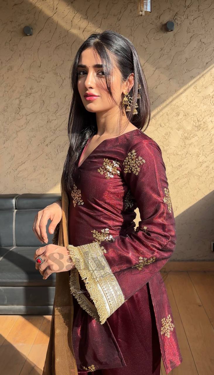 A Portrait of Grace in a Luxurious Maroon Ensemble
