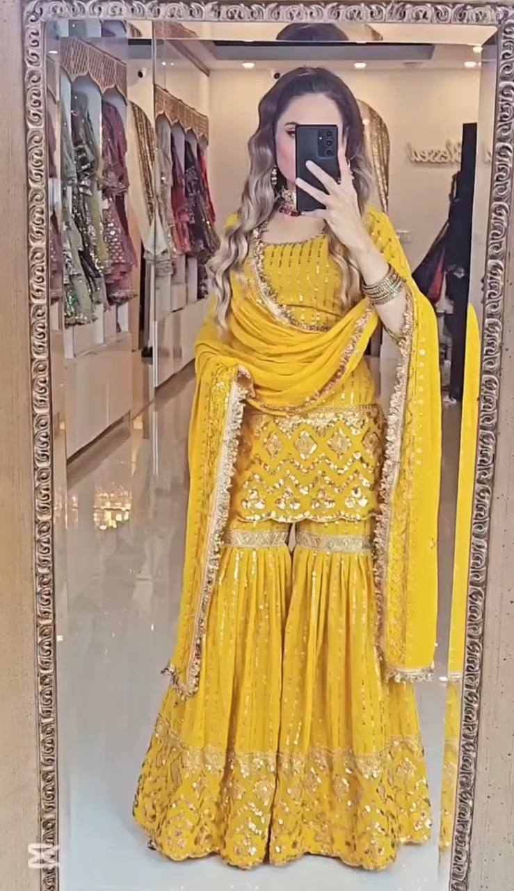 A Captivating Showcase of a Woman in Bold Black and Vibrant Yellow Attire