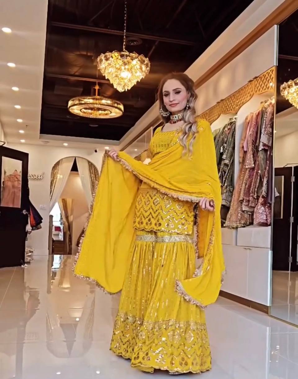 A Captivating Showcase of a Woman in Bold Black and Vibrant Yellow Attire