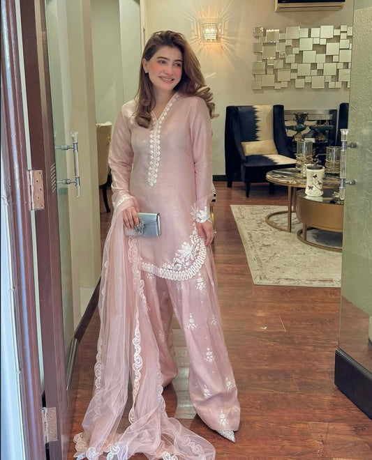A Vision of Confidence in a Stylish Pink Suit