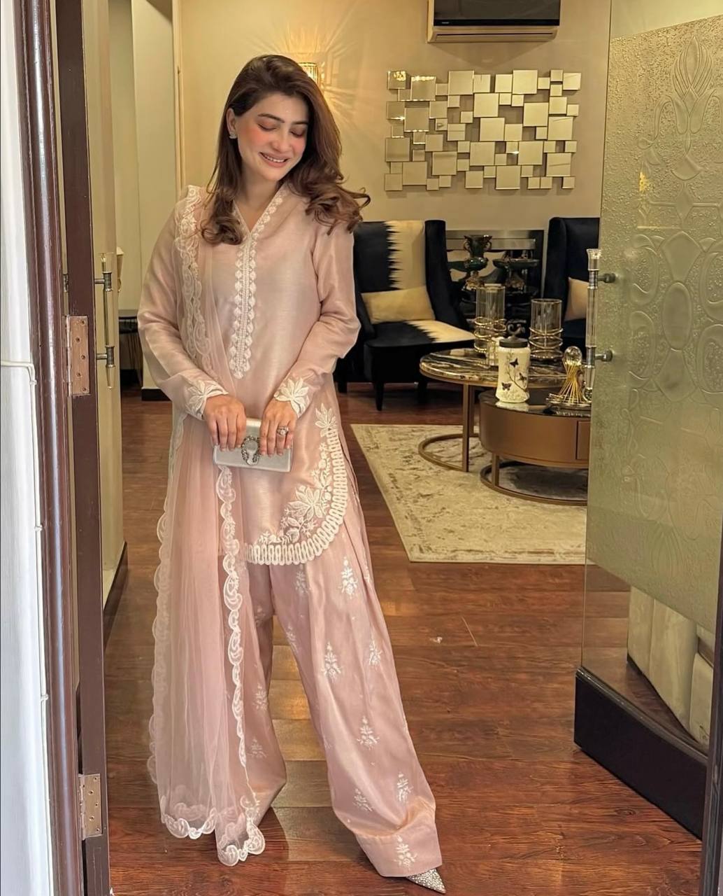 A Vision of Confidence in a Stylish Pink Suit