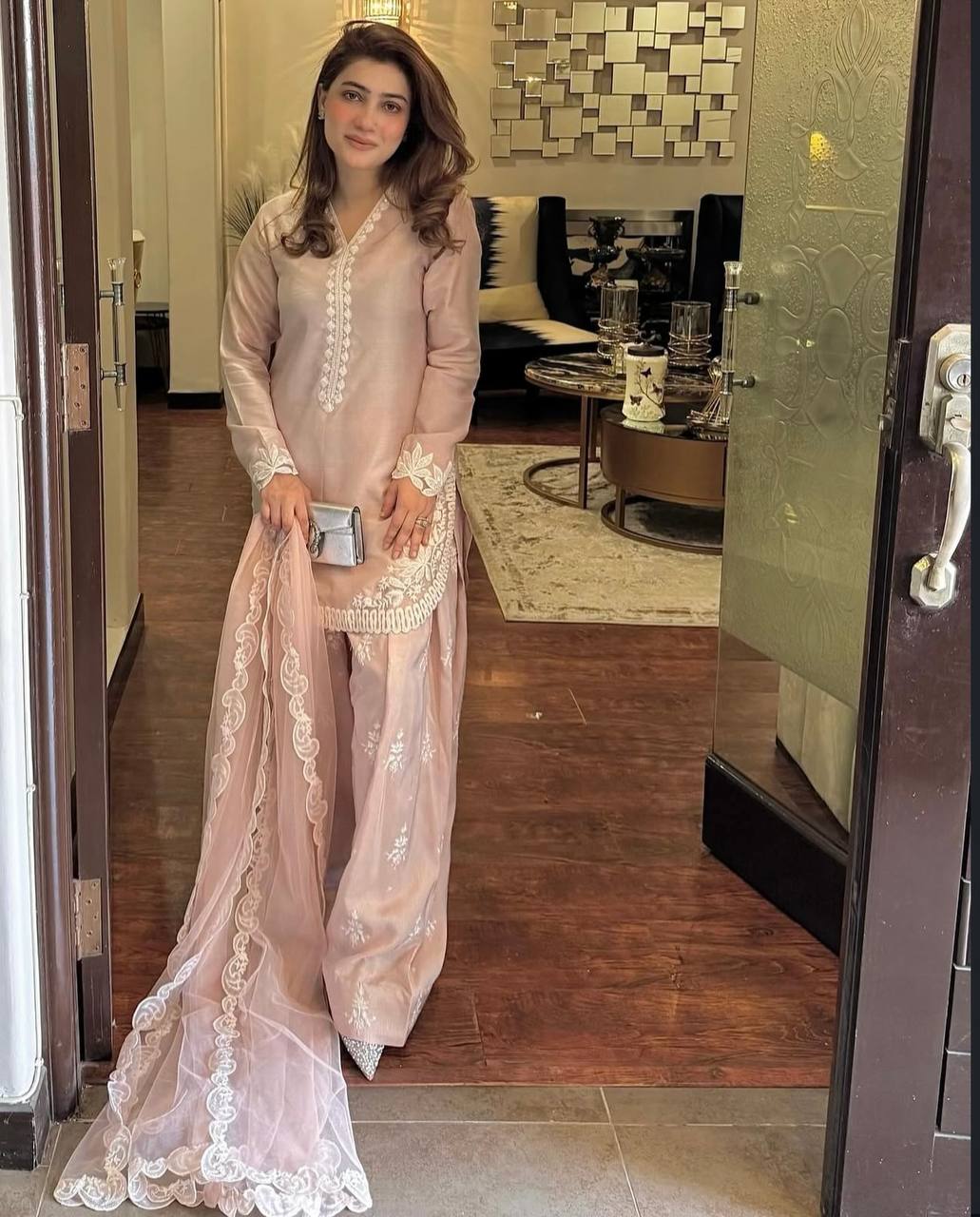 A Vision of Confidence in a Stylish Pink Suit