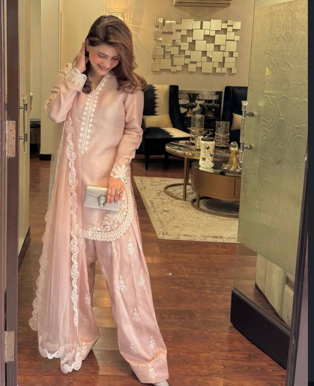 A Vision of Confidence in a Stylish Pink Suit