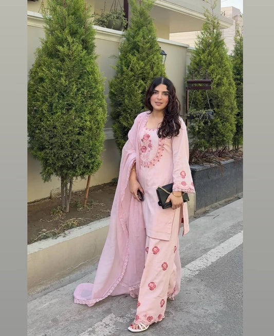 A Woman in Elegant Pink Attire Enjoying a Peaceful