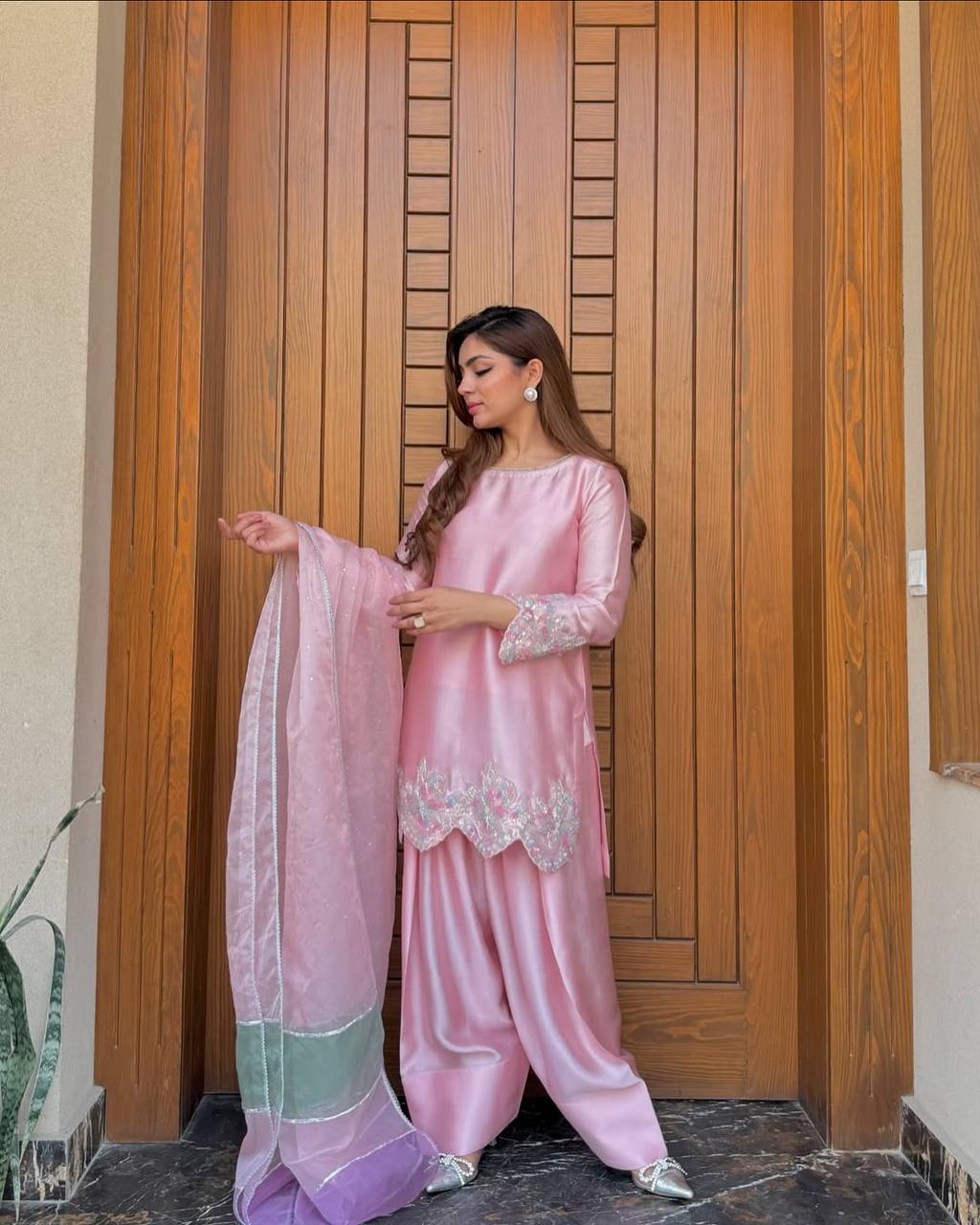 A Fashion-Forward Woman in Pink Suit